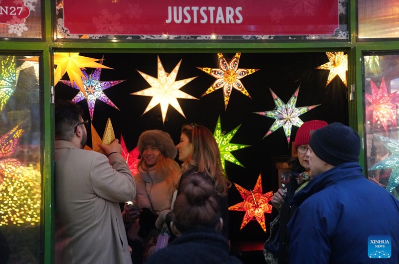People shop at a holiday market of the Winter Village at Bryant Park in New York, the United States, on Nov. 15, 2025. Featuring a holiday market, a skating rink and a food hall, the Winter Village is a popular winter holiday destination at Bryant Park. Photo: Xinhua