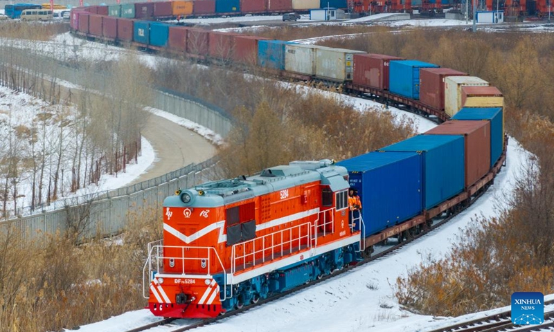 This aerial drone photo taken on Nov. 16, 2025 shows a China-Europe freight train departing from the transshipment yard of Tongjiang North Railway Station in Tongjiang City, northeast China's Heilongjiang Province. As an important part of the eastern corridor of the China-Europe freight train service, Tongjiang Railway Port has handled a total of 273 China-Europe freight train trips since it was launched in 2022, with over 14 million tonnes of imported and exported goods, according to data from China Railway Harbin Group Co., Ltd. Photo: Xinhua