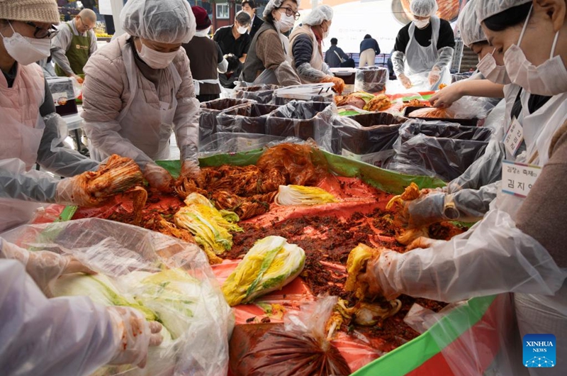 People make Kimchi, pickled vegetable, for a sharing event at the Jogyesa temple in Seoul, South Korea, Nov. 16, 2025. Local people made Kimchi, which will be shared with their neighbours in need, during a sharing event held here on Sunday. Photo: Xinhua