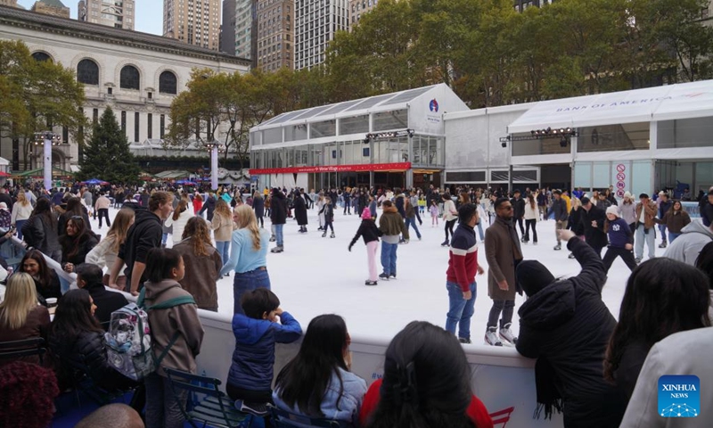 People skate on an ice rink of the Winter Village at Bryant Park in New York, the United States, on Nov. 15, 2025. Featuring a holiday market, a skating rink and a food hall, the Winter Village is a popular winter holiday destination at Bryant Park. Photo: Xinhua