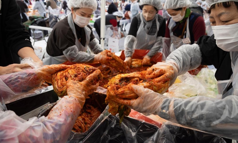 People make Kimchi, pickled vegetable, for a sharing event at the Jogyesa temple in Seoul, South Korea, Nov. 16, 2025. Local people made Kimchi, which will be shared with their neighbours in need, during a sharing event held here on Sunday. Photo: Xinhua