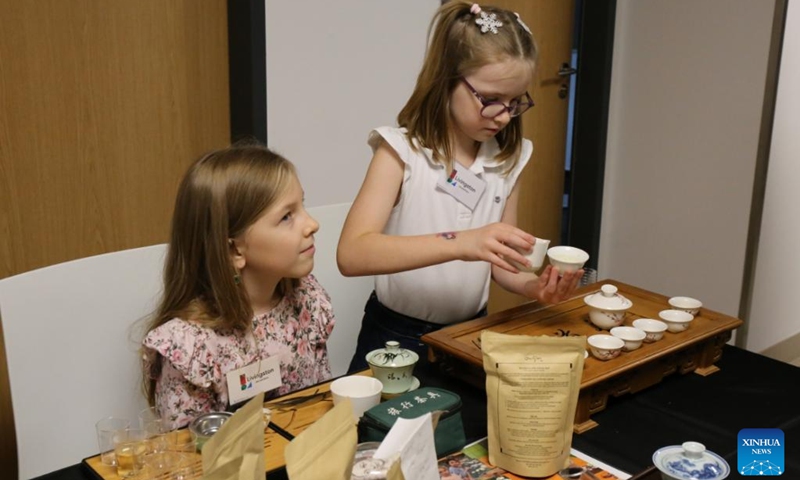 Children try Chinese tea ceremony during the 2025 Euro Tea Expo held in Prague, the Czech Republic, Nov. 15, 2025. The 2025 Euro Tea Expo concluded on Sunday in Prague, bringing together tea experts, exhibitors and enthusiasts from around the world, with this year's focus on Chinese Pu'er tea and southwest China's Yunnan Province. Photo: Xinhua
