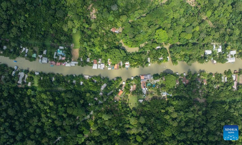 An aerial drone photo taken on Nov. 16, 2025 shows tropical rainforest and waterways in Belem, Brazil. (Xinhua/Wang Tiancong)