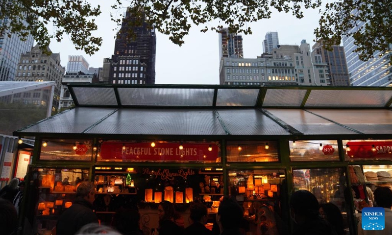 People visit the Winter Village at Bryant Park in New York, the United States, on Nov. 15, 2025. Featuring a holiday market, a skating rink and a food hall, the Winter Village is a popular winter holiday destination at Bryant Park. Photo: Xinhua