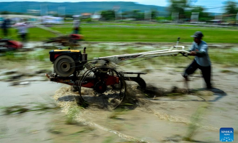 Farmers participate in a rice field tractors racing on a muddy rice field in Kebonagung village, Bantul regency, Yogyakarta, Indonesia, Nov. 16, 2025. (Photo by Agung Supriyanto/Xinhua)
