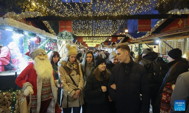 People visit a Christmas market in downtown Budapest, Hungary, on Nov. 15, 2025. The market opened here on Friday and will last till Jan. 1, 2026. (Photo by Attila Volgyi/Xinhua)