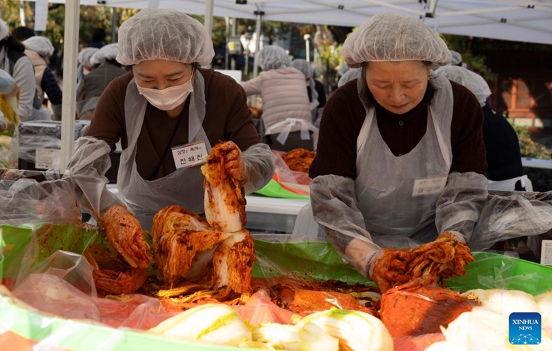 People make Kimchi, pickled vegetable, for a sharing event at the Jogyesa temple in Seoul, South Korea, Nov. 16, 2025. Local people made Kimchi, which will be shared with their neighbours in need, during a sharing event held here on Sunday. Photo: Xinhua