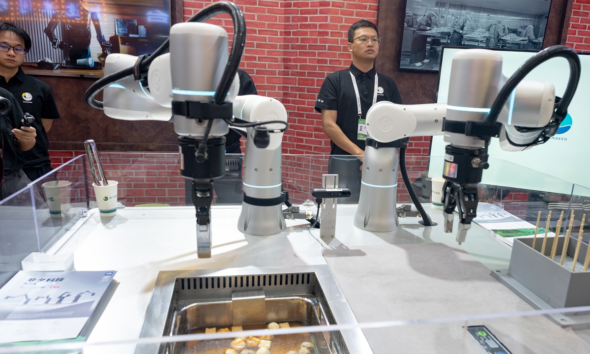 Exhibitor display a catering industry robot that is capable of identifying different foods and serving skewered items on bamboo sticks and deliver them to consumers on July 27, 2025 at the 2025 WAIC in Shanghai. Photo: VCG
