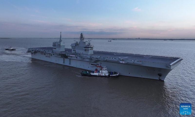 China's first Type 076 amphibious assault ship, the Sichuan, returns to the shipyard after completing its maiden sea trial on Nov. 16, 2025. The Sichuan returned to the shipyard in Shanghai at around 5 p.m. Sunday after completing its maiden sea trial. (Photo by Zhang Liang/Xinhua)