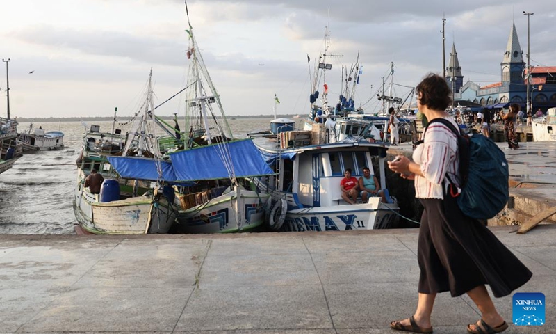 Fishing boats are seen moored at the port in Belem, Brazil, Nov. 16, 2025. (Photo by Claudia Martini/Xinhua)