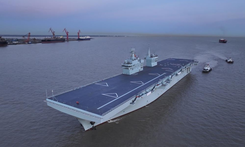 China's first Type 076 amphibious assault ship, the Sichuan, returns to the shipyard after completing its maiden sea trial on Nov. 16, 2025. The Sichuan returned to the shipyard in Shanghai at around 5 p.m. Sunday after completing its maiden sea trial.(Photo by Zhang Liang/Xinhua)