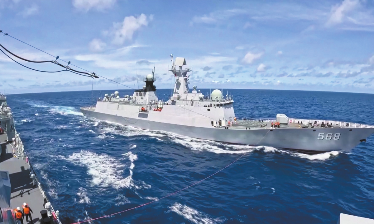 The photo released on November 18, 2025 shows that comprehensive replenishment ship Honghu of the Chinese People's Liberation Army (PLA) Navy arrives at the supply area and prepares to provide supplies for guided-missile frigate Hengyang in the South China Sea. The PLA Navy recently conducted several days of multi-domain, combat-oriented live-fire drills in the South China Sea. Photo: VCG