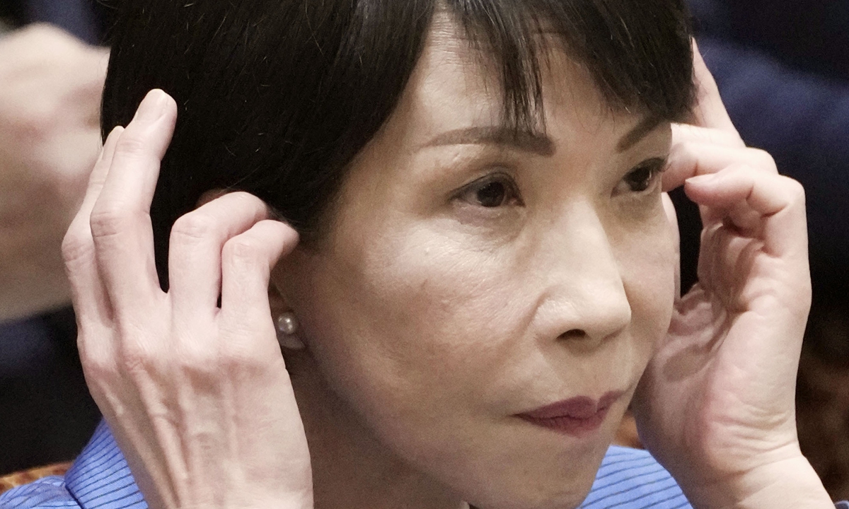 Japanese Prime Minister Sanae Takaichi listens to a question during a House of Councillors Budget Committee session in Tokyo on November 12, 2025.
