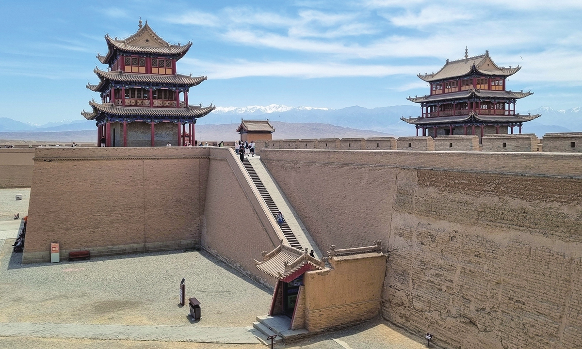 The fortresses in Jiayuguan, Northwest China's Gansu Province, marks the western end of the Great Wall, with the Qilian Mountains in the background.