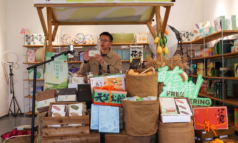 A man promotes rural specialty agricultural products via live-streaming in Dongluo Village of Xinghua, east China's Jiangsu Province, Nov. 21, 2025. Local authorities in Xinghua have sought to embed environmental construction into the rural industry landscape in recent years, helping create numerous villages that are both livable and suitable for business operations. Photo: Xinhua