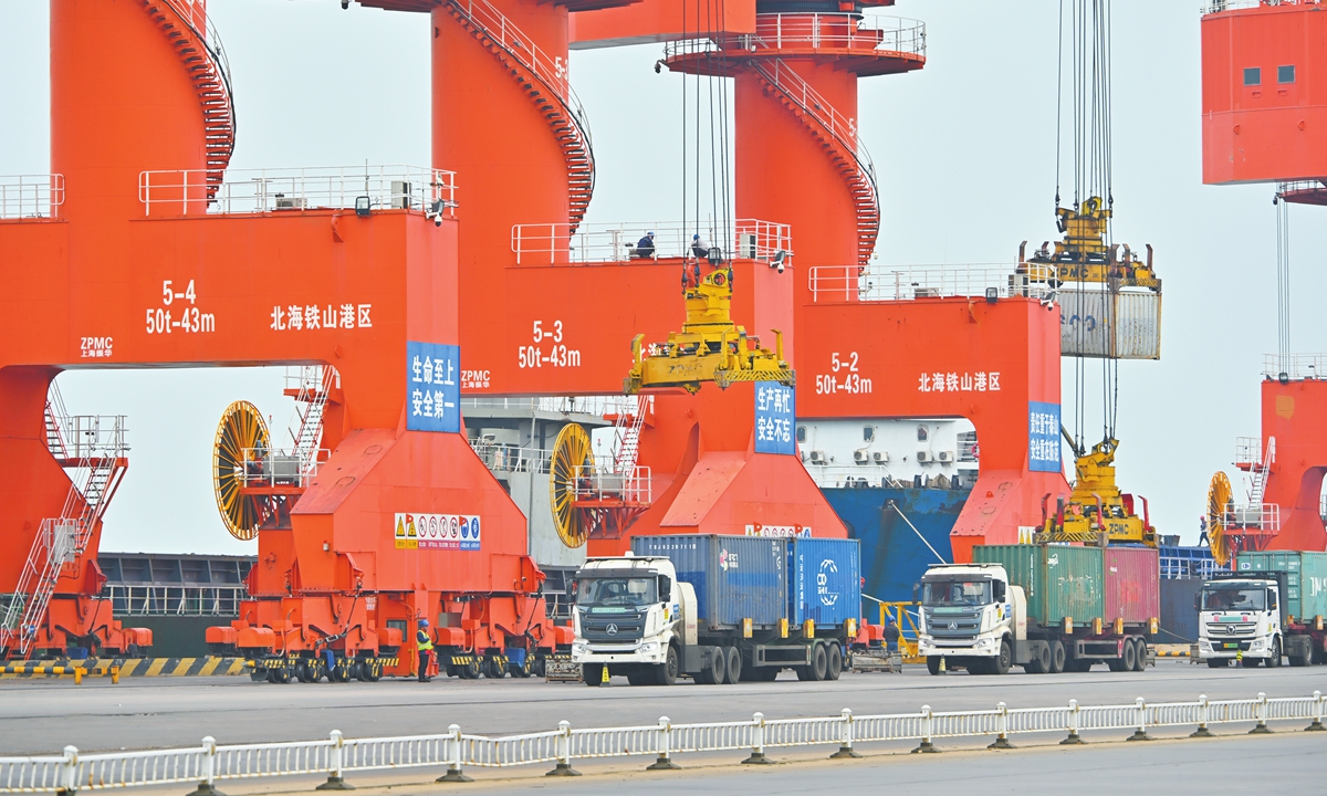 Trucks loaded with containers of goods shuttle through the Tieshan Port Public Wharf located in Beihai, South China's Guangxi Zhuang Autonomous Region. Photo: Tao Mingyang/GT