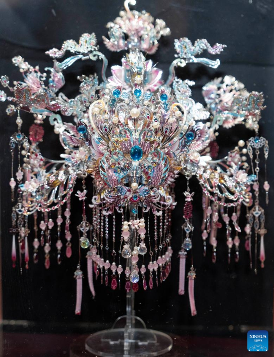 This photo taken on Nov. 21, 2025 shows a phoenix coronet at an exhibition held at the Sensory Experience Gallery of the Palace Museum in Beijing, capital of China. Featuring artworks created by disabled artists from Shanghai, the exhibition kicked off here on Friday. Under the guidance of inheritors of intangible cultural heritages, these artists infused their love for life and reverence for culture into their works. Photo: Xinhua