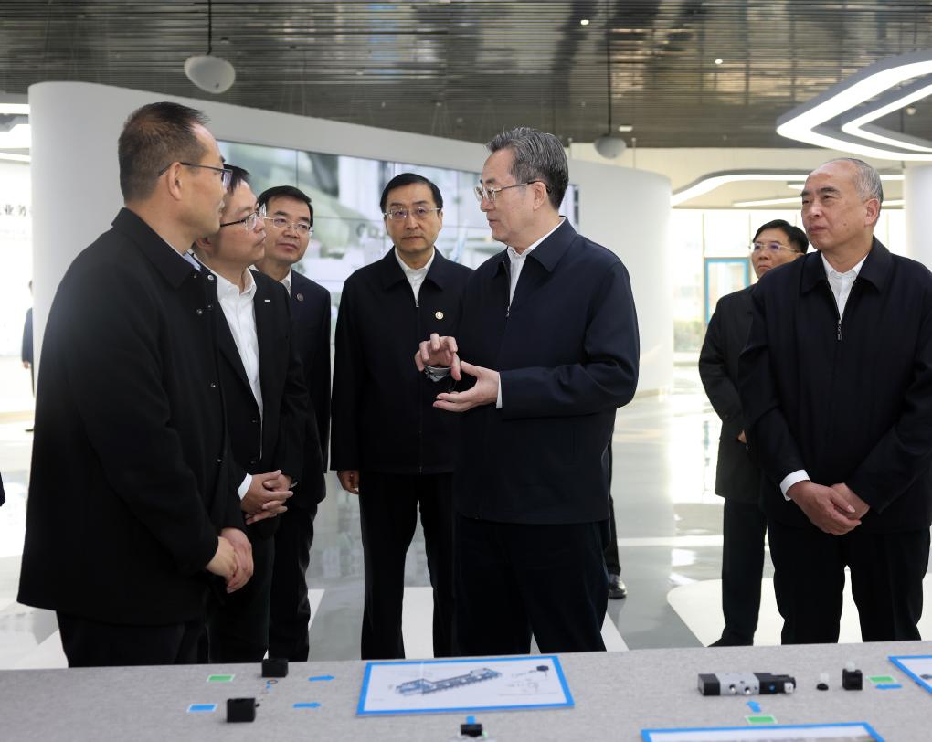 Chinese Vice Premier Ding Xuexiang, also a member of the Standing Committee of the Political Bureau of the Communist Party of China Central Committee, pays a visit to a company to learn about the development of advanced and intelligent manufacturing in Jinan, east China's Shandong Province, Nov. 20, 2025. Ding made research trips to Shandong and Hebei provinces from Nov. 20 to 22. (Xinhua/Liu Weibing)