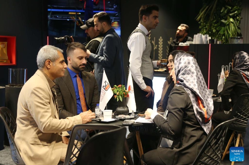 People talk with each other at the 22nd International Exhibition of Metallurgy, also known as Iran METAFO, in Tehran, Iran, Nov. 20, 2025. The four-day event came to an end on Nov. 23, attracting 610 Iranian companies as well as 113 foreign firms. (Xinhua/Shadati)