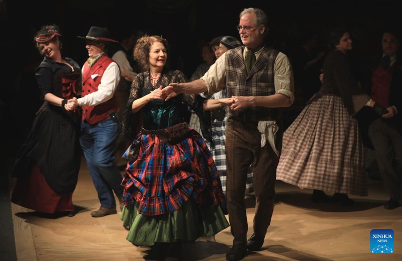 People wearing costumes of the Victorian era dance during the Great Dickens Christmas Fair in San Francisco, the United States, Nov. 22, 2025.

The Great Dickens Christmas Fair, which was first held in 1970, opened here on Saturday. Featuring an immersive adventure into Victorian era, the fair transports visitors in a world created by British novelist Charles Dickens in a festive mood. Photo: Xinhua
