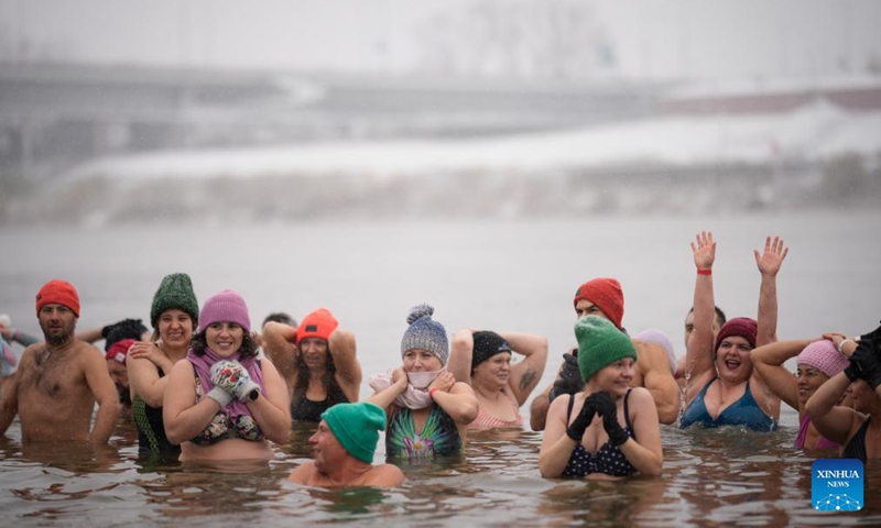 Winter swimming enthusiasts take a dip in the icy waters of the Vistula River in Warsaw, Poland, on Nov. 23, 2025. Sunday marked the opening of the cold-water swimming season in Warsaw. (Photo by Jaap Arriens/Xinhua)
