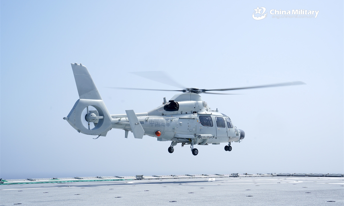A Z-9D ship-borne helicopter attached to a naval frigate flotilla under the Chinese PLA Eastern Theater Command lifts off from the amphibious assault ship Anhui (Hull 33) during a take-off and landing training exercise. (eng.chinamil.com.cn/Photo by Tang Haoran)