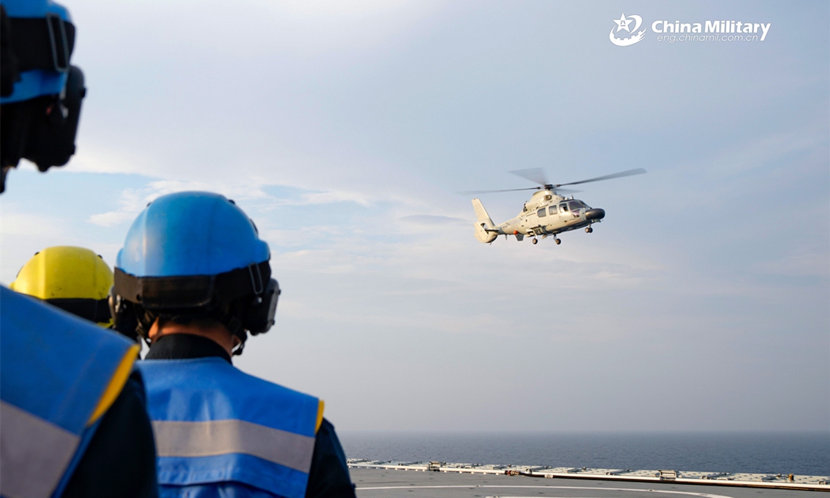 A Z-9D ship-borne helicopter attached to a naval frigate flotilla under the Chinese PLA Eastern Theater Command lifts off from the amphibious assault ship Anhui (Hull 33) during a take-off and landing training exercise. (eng.chinamil.com.cn/Photo by Tang Haoran)