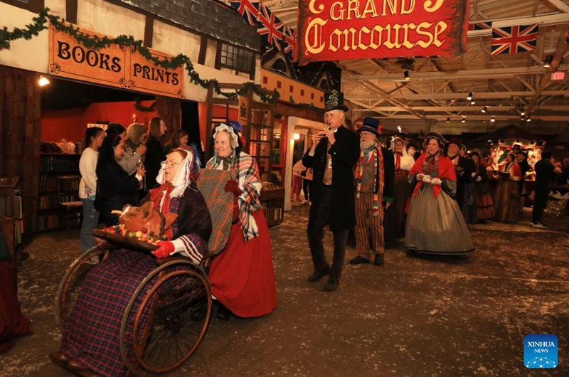 People wearing costumes of the Victorian era attend the Great Dickens Christmas Fair in San Francisco, the United States, Nov. 22, 2025.

The Great Dickens Christmas Fair, which was first held in 1970, opened here on Saturday. Featuring an immersive adventure into Victorian era, the fair transports visitors in a world created by British novelist Charles Dickens in a festive mood. Photo: Xinhua
