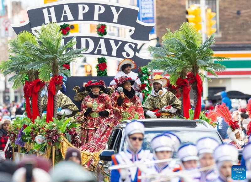 A dressed-up band performs on a float during the 2025 Original Santa Claus Parade in Toronto, Canada, on Nov. 23, 2025. Featuring dozens of themed floats and marching bands, the annual parade was held here on Sunday. (Photo by Zou Zheng/Xinhua)