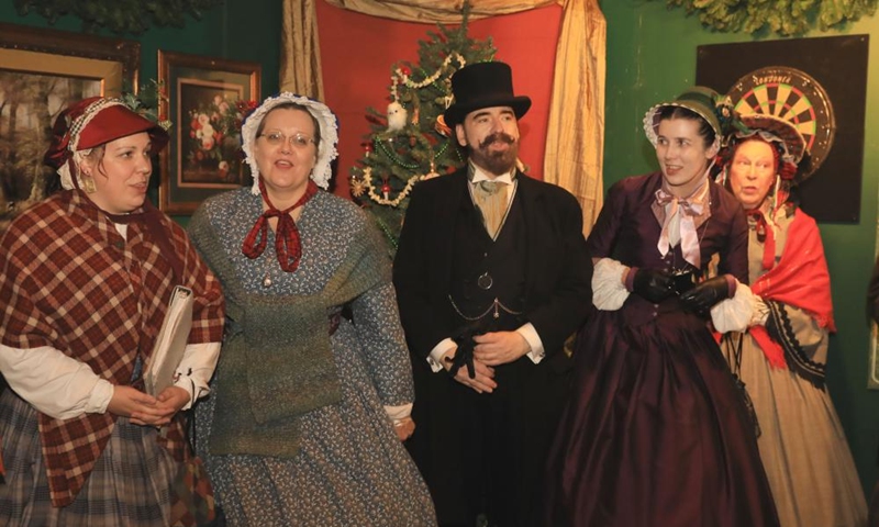People wearing costumes of the Victorian era attend the Great Dickens Christmas Fair in San Francisco, the United States, Nov. 22, 2025.

The Great Dickens Christmas Fair, which was first held in 1970, opened here on Saturday. Featuring an immersive adventure into Victorian era, the fair transports visitors in a world created by British novelist Charles Dickens in a festive mood. Photo: Xinhua
