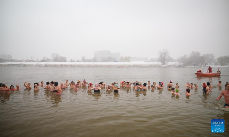 Winter swimming enthusiasts take a dip in the icy waters of the Vistula River in Warsaw, Poland, on Nov. 23, 2025. Sunday marked the opening of the cold-water swimming season in Warsaw. (Photo by Jaap Arriens/Xinhua)