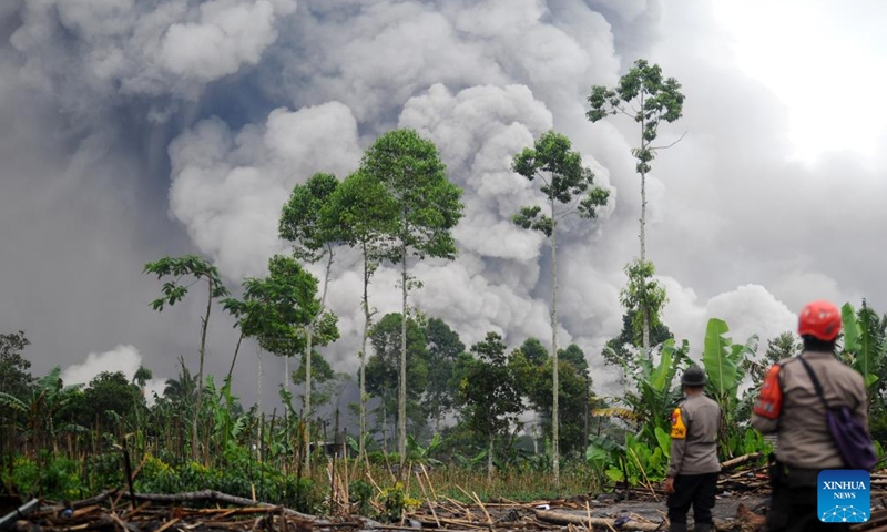 This photo taken on Nov. 23, 2025 shows volcanic materials spewing from Mount Semeru in Lumajang regency, East Java, Indonesia. Indonesia's Semeru volcano erupted on Wednesday, prompting the country's volcanology agency to raise the alert level to the maximum. (Photo by Sahlan Kurniawan/Xinhua)