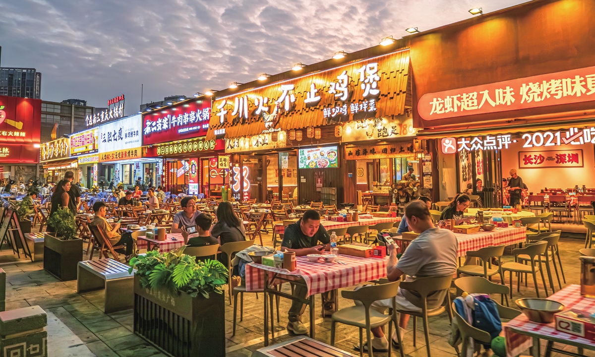 From sizzling woks to bustling streets, China's late-night snacks shape city life
