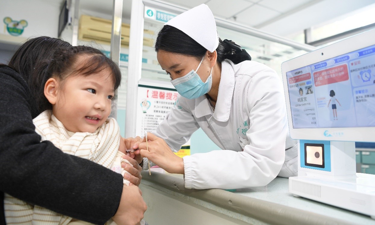 A nurse administers influenza vaccine to a child at a local clinic in Guiyang, Southwest China's Guizhou Province on November 13, 2025. Photo: VCG