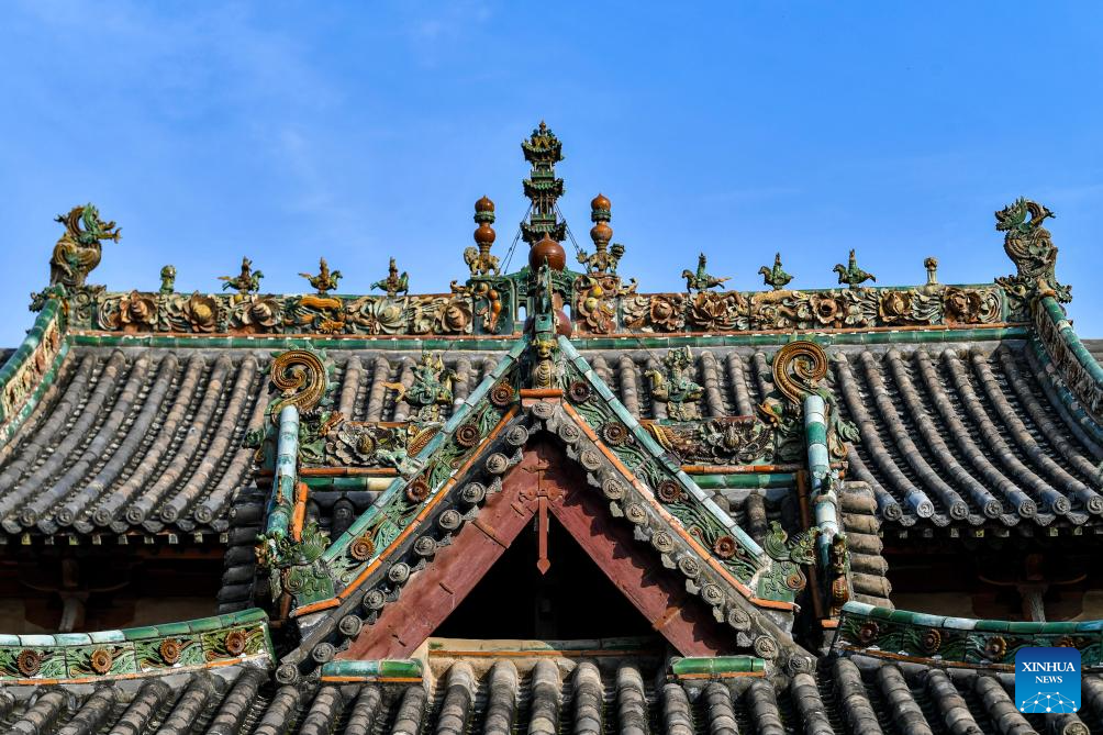 This photo taken on Nov. 12, 2025 shows decorative parts on the rooftop of an ancient building at Dongyue Temple in Wanrong County of north China's Shanxi Province. Auspicious creatures are often seen on the rooftops of ancient architecture in north China's Shanxi Province. Those creatures, originally used for water-proofing, moisture-proofing and ridge protection, have evolved through the times and formed the shapes of dragon, phoenix and lion, conveying people's wishes of warding off evil and fire, and also bringing fortune. Gradually, they became the symbols of power judged by the number, quality and colors in ancient times. (Xinhua/Cao Yang)