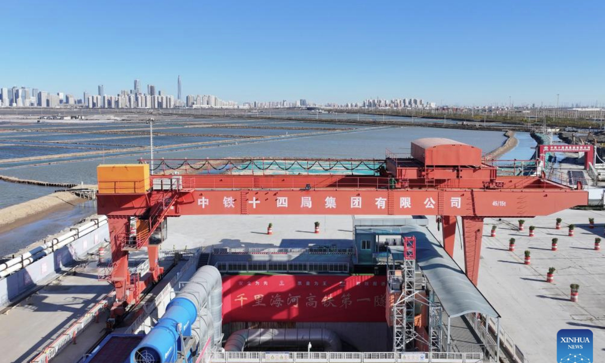 A drone photo taken on Nov. 27, 2025 shows a view of the construction site of the Jingu Haihe Tunnel for the Tianjin-Weifang High-Speed Railway in Tianjin, north China. The Jingu Haihe Tunnel project for Tianjin-Weifang High-Speed Railway was drilled through successfully on Thursday.

The 6.7-kilometer long Jingu Haihe Tunnel is the only tunnel along the entire railway line, with a maximum excavation diameter reaching 13.8 meters. It is also the first tunnel for high-speed railway across Haihe River.

The Tianjin-Weifang railway will connect Binhai Station in Tianjin and Weifang North Station in east China's Shandong Province, with a total length of approximately 349 kilometers and a designed speed of 350 kilometers per hour. (Xinhua/Li Ran)