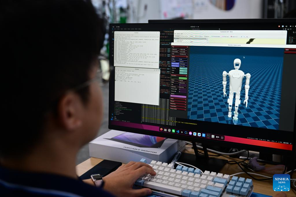 An engineer runs a simulation program at Leju Robotics in Hefei, east China's Anhui Province, Oct. 24, 2025. In recent years, Hefei has been actively promoting the development of its intelligent robot industry. The city is now home to a full-chain industrial system for research, development and manufacturing of robotics that comprises 190 related enterprises. (Xinhua/Zhou Mu)