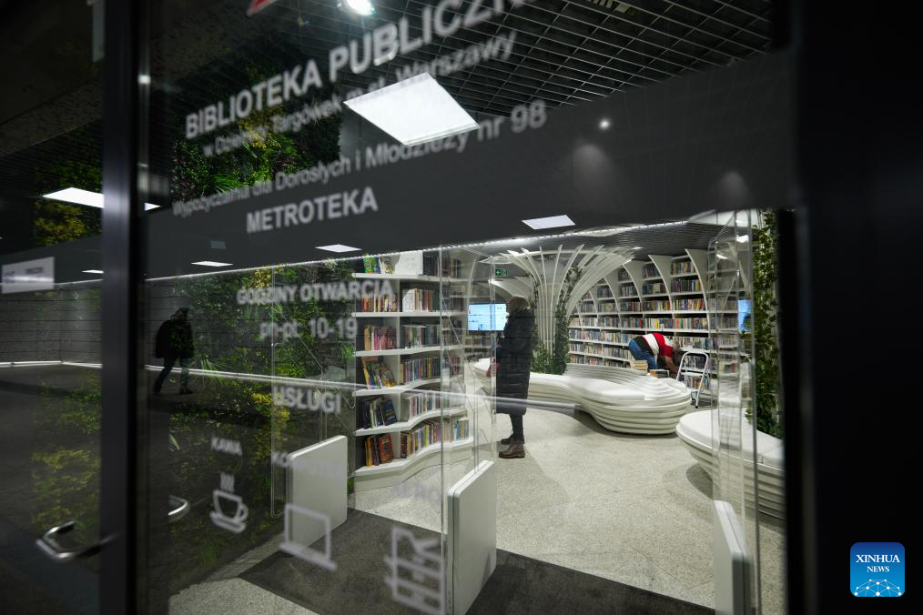 People visit Metroteka, an underground library recently opened at Kondratowicza metro station, in Warsaw, Poland, Nov. 26, 2025. (Photo by Jaap Arriens/Xinhua)