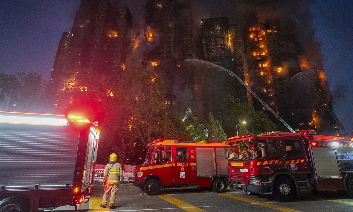 Firefighters work to extinguish a fire which broke out at Wang Fuk Court, a residential estate in the Tai Po district of Hong Kong's New Territories on November 26, 2025. Photo: VCG