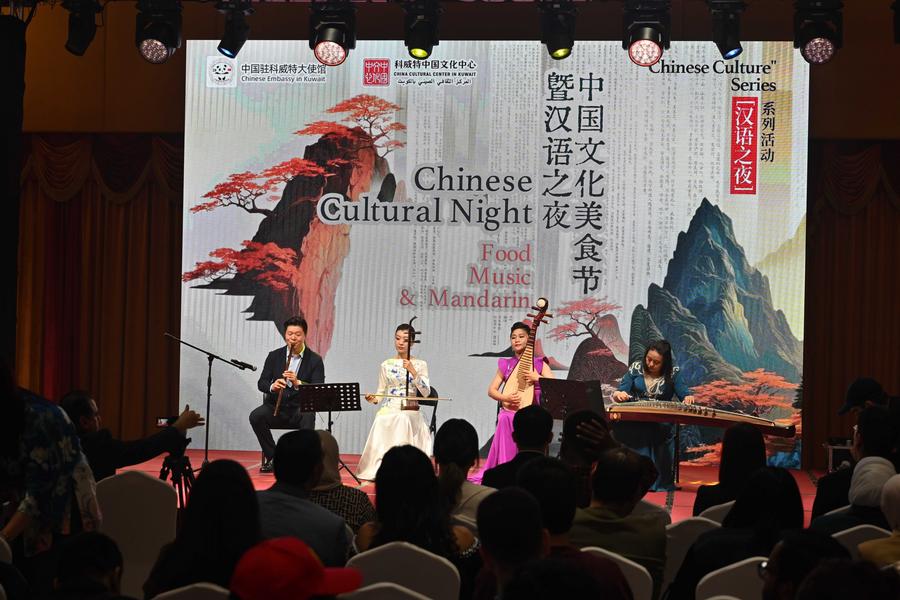 People enjoy Chinese traditional instrumental works during the Chinese culture night event at the Chinese Embassy in Kuwait in Hawalli Governorate, Kuwait, Nov. 26, 2025. (Photo by Asad/Xinhua)