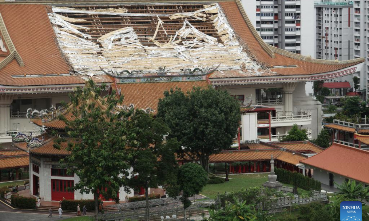 This photo shows the hole left by the fallen roof tiles of the Venerable Hong Choon Memorial Hall of Singapore's Kong Meng San Phor Kark See Monastery on Nov. 27, 2025. (Photo by Then Chih Wey/Xinhua)