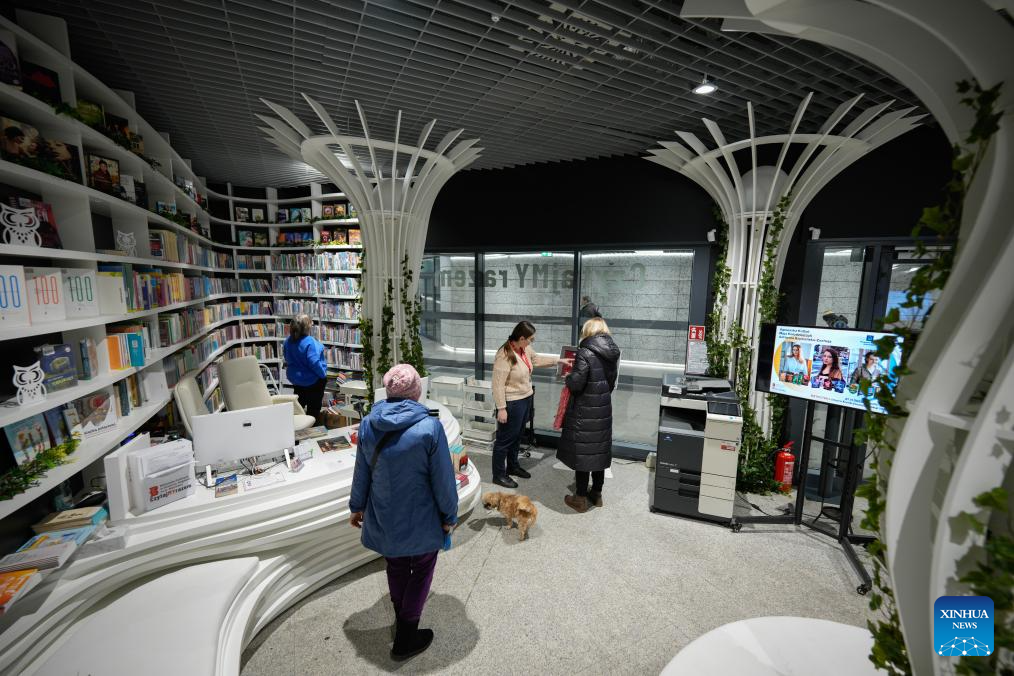 People visit Metroteka, an underground library recently opened at Kondratowicza metro station, in Warsaw, Poland, Nov. 26, 2025. (Photo by Jaap Arriens/Xinhua)
