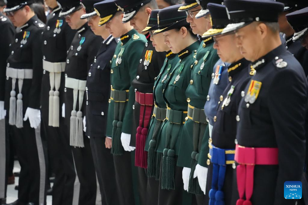 A memorial service is held for victims of the residential building fire in Hong Kong, south China, Nov. 29, 2025. The national flag and the Hong Kong Special Administrative Region flag were flown at half-mast at all government buildings. (Xinhua/Zhu Wei)