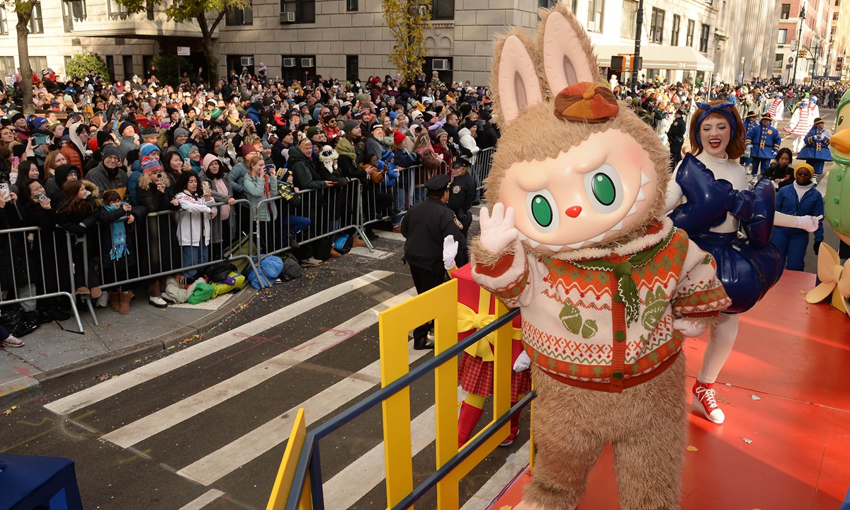 Labubu greets enthusiastic crowds from the POP MART 'POP CITY' float on November 27, 2025 in New York City during the Macy's Thanksgiving Day Parade. A star-studded lineup of performances is sprinkled throughout the show, along with a slew of marching bands, dancers and cheerleaders.Photo: VCG 