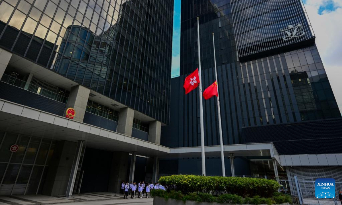 A memorial service is held for victims of the residential building fire in Hong Kong, south China, Nov. 29, 2025. The national flag and the Hong Kong Special Administrative Region flag were flown at half-mast at all government buildings. (Xinhua/Zhu Wei)