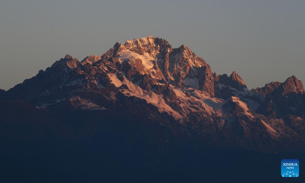 This photo shows sunlight shining on the Yulong Snow Mountain in Lijiang, southwest China's Yunnan Province, Nov. 29, 2025. (Photo by Zhao Qingzu/Xinhua)