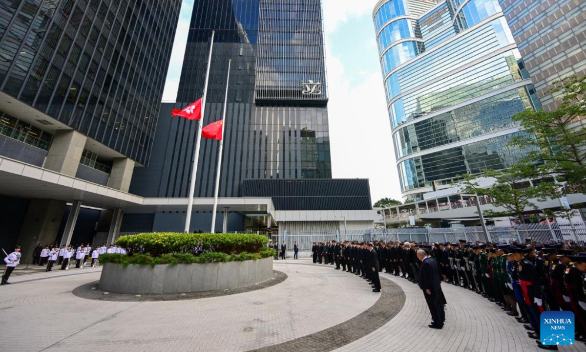 A memorial service is held for victims of the residential building fire in Hong Kong, south China, Nov. 29, 2025. The national flag and the Hong Kong Special Administrative Region flag were flown at half-mast at all government buildings. (Xinhua/Zhu Wei)