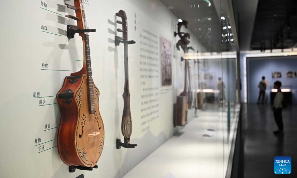 Musical instruments are on display during an exhibition themed on various music cultures along the ancient Silk Road at Guangzhou Maritime Museum in Guangzhou, south China's Guangdong Province, Nov. 29, 2025. The exhibition kicked off here on Saturday, showcasing 143 ancient musical instruments from countries along the Silk Road. The exhibition, which will run until April 6, 2026, presents the historical context and artistic integration of musical instruments in the cultural exchanges between the East and the West. (Xinhua/Deng Hua)