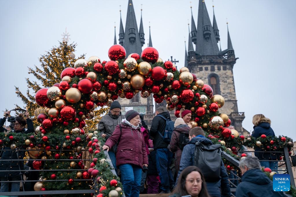 People visit a Christmas market in Prague, the Czech Republic, Nov. 29, 2025. The Christmas market in Prague's Old Town officially opened on Saturday, attracting large numbers of residents and tourists. (Photo by Dana Kesnerova/Xinhua)