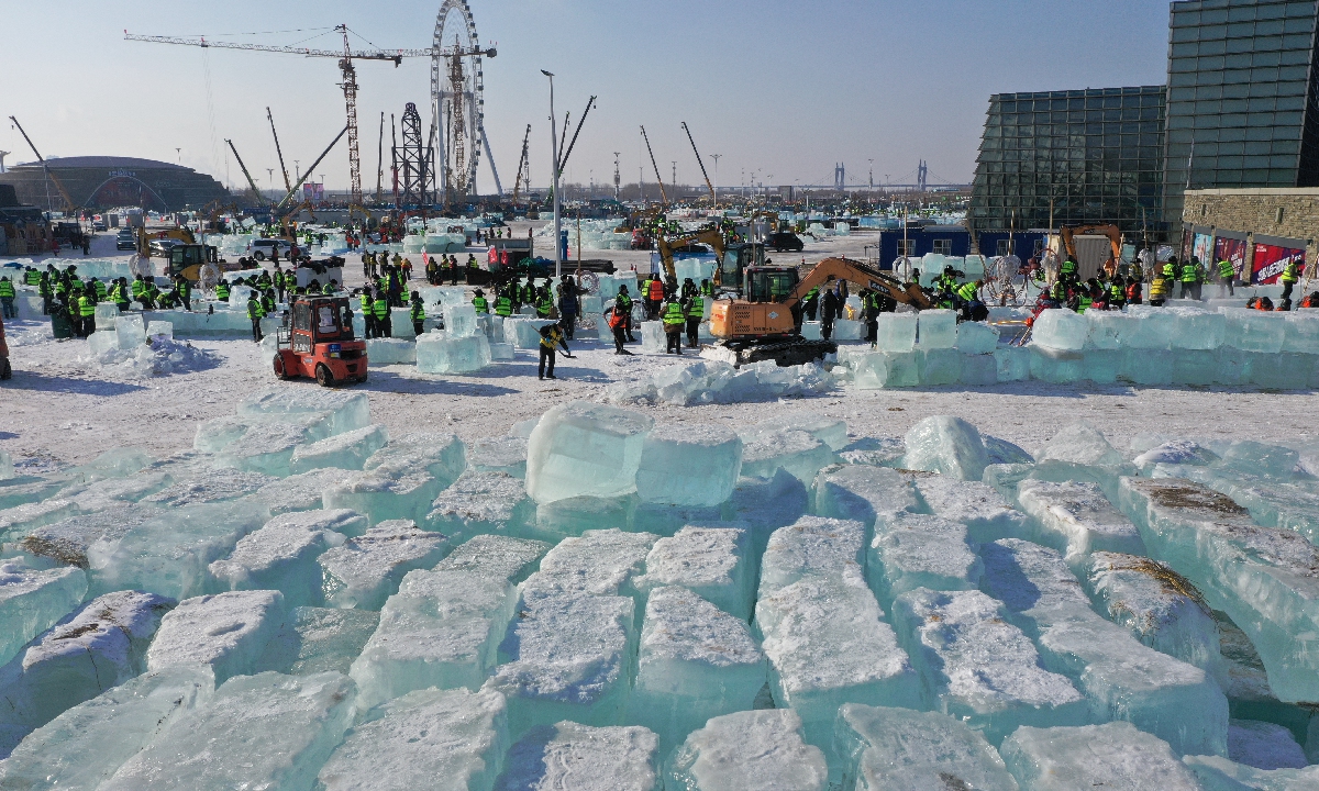 Workers prepare attractions at Harbin Ice and Snow World on November 30, 2025, as tower cranes rise above the site and hundreds of trucks, loaders, forklifts and bulldozers operate on the ground, with several ice structures already taking shape.  Photo: VCG